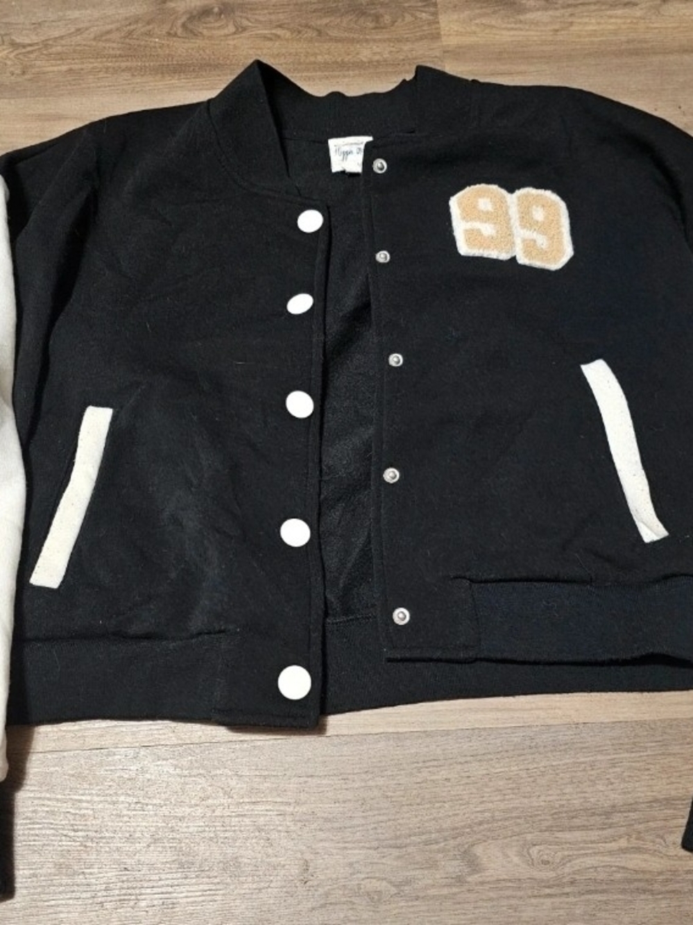 Vintage-Inspired Cropped Black & White Varsity Jacket with '99 Patch